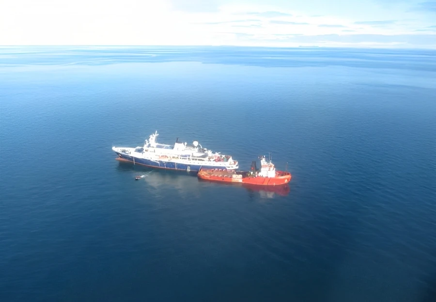 Two ships docked stern-to-stern
